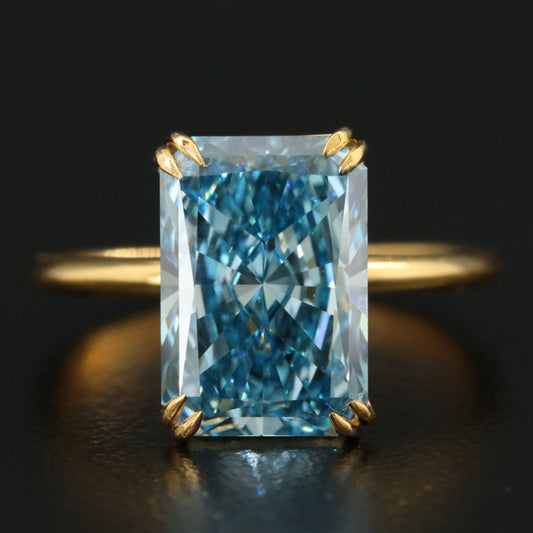 2.4ct blue radiant 18k yellow gold ring