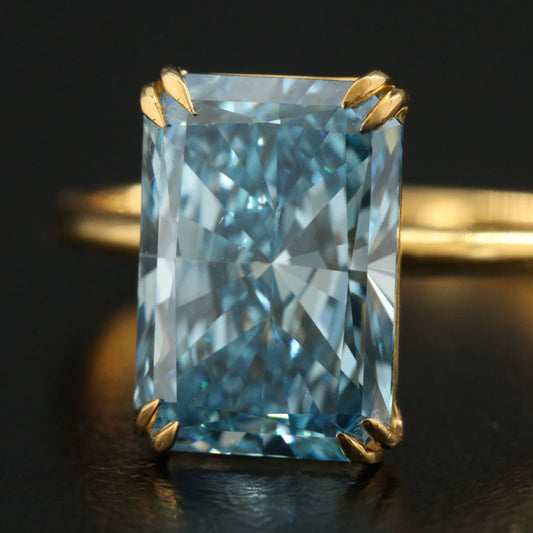 2.4ct blue radiant 18k yellow gold ring